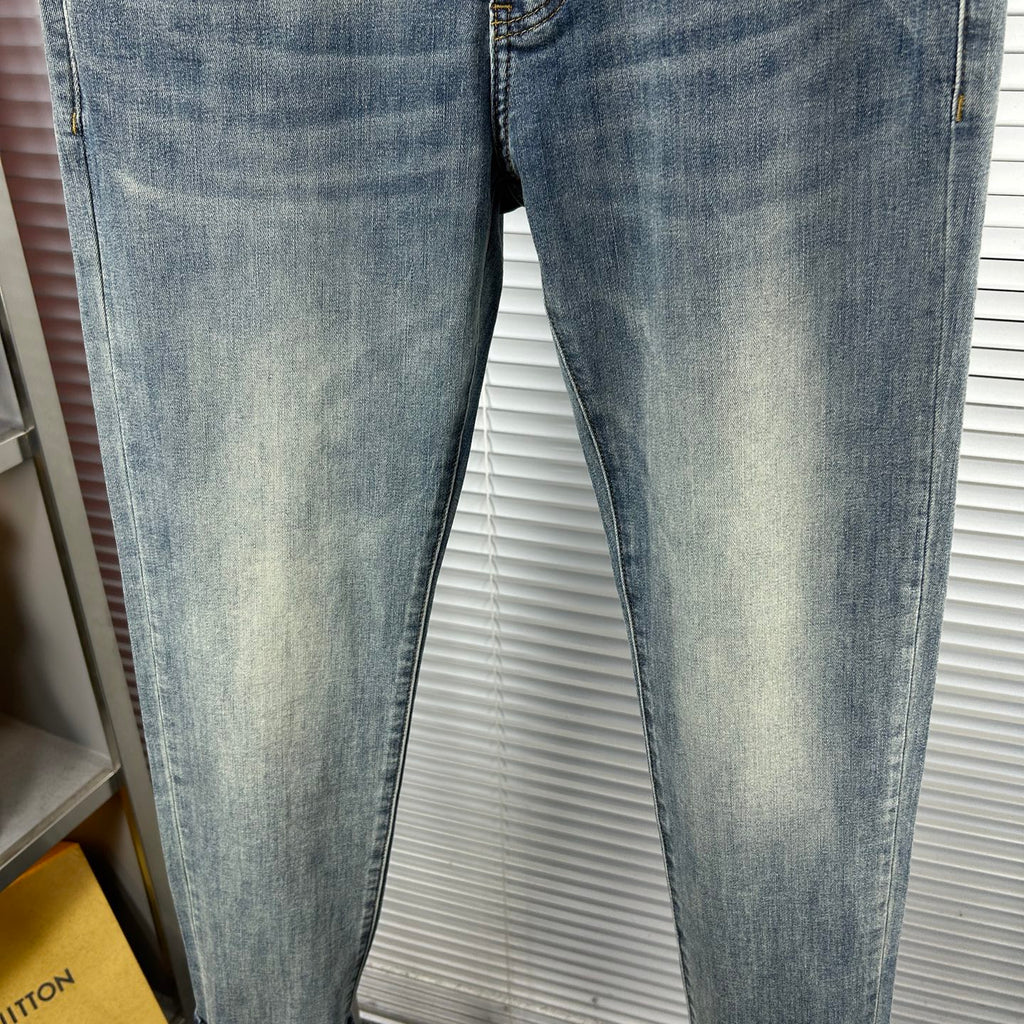 Light blue slim-fit denim jeans with faded wash and straight hems