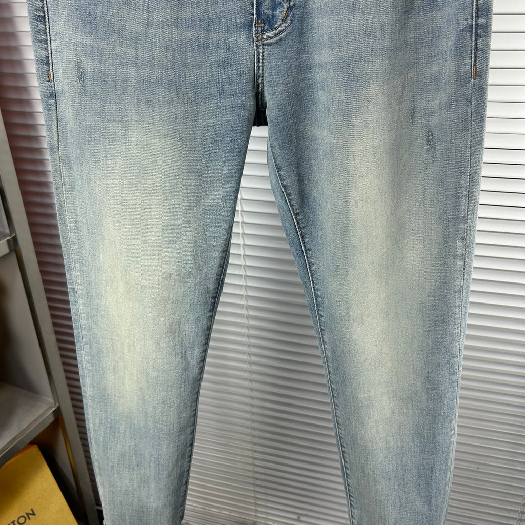 Light blue denim jeans with faded wash and vertical seam stitching