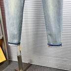 Light blue denim cuffs with contrast stitching and rolled-up hem edge