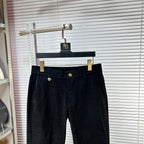 Versace dark jeans with elastic waistband and gold emblem button, front view