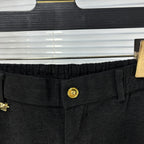 Versace dark jeans waistband with gold logo button and elastic stretch