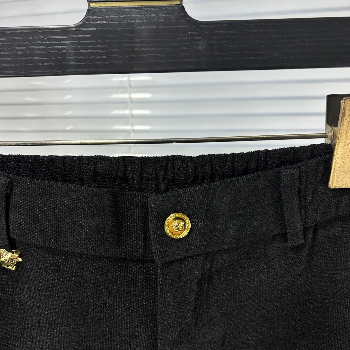 Versace dark jeans waistband with gold logo button and elastic stretch
