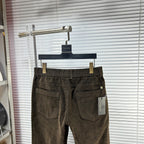 Versace trousers front view in dark brown textured fabric with side pockets and belt loops