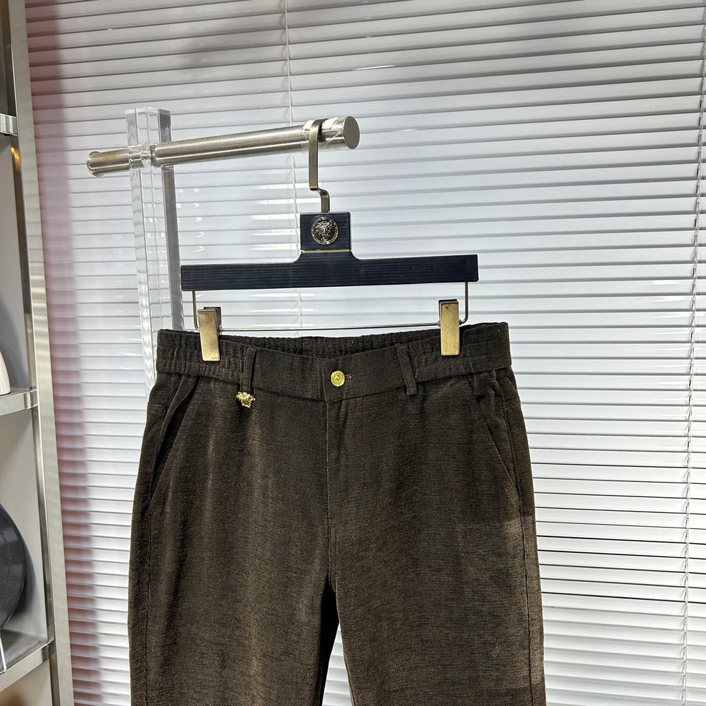 Versace trousers with dark brown waistband, gold button detail, belt loops, front pleats