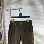 Versace trousers with dark brown waistband, gold button detail, belt loops, front pleats