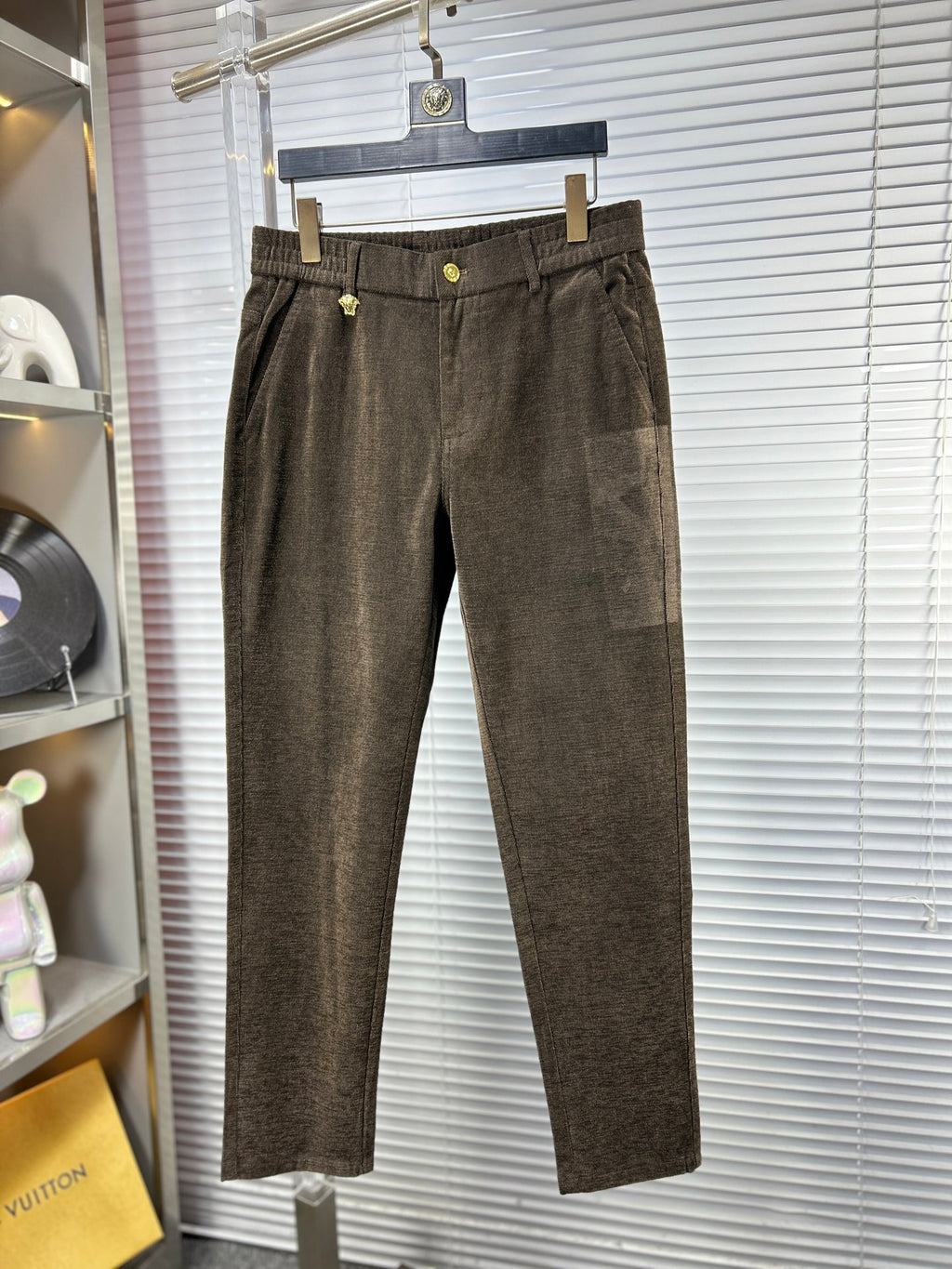 Versace trousers in dark brown textured fabric, button closure, side pockets, belt loops