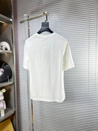 Versace white T-shirt with small studded graphic detail on the back hem
