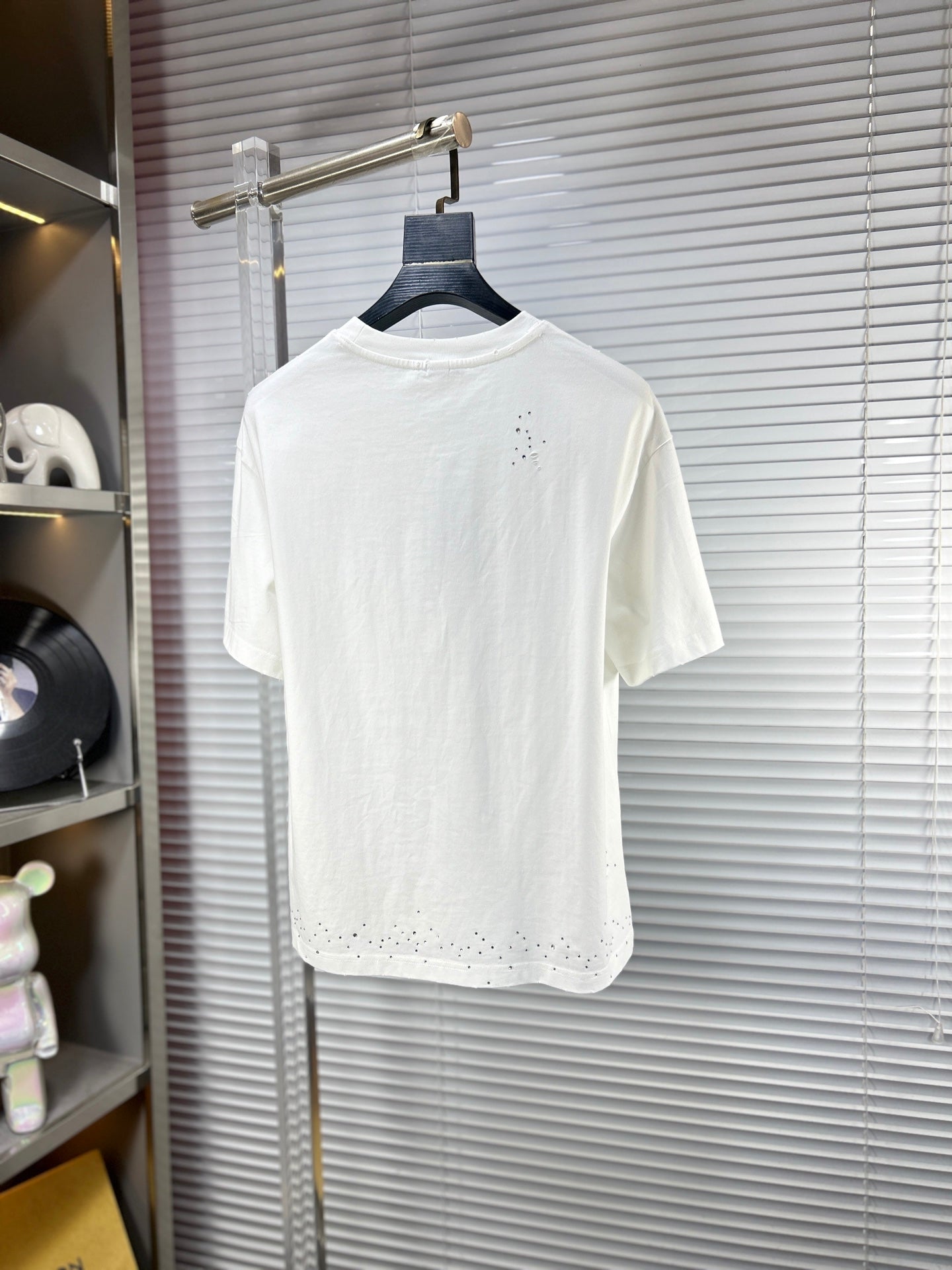 Versace white T-shirt with small studded graphic detail on the back hem