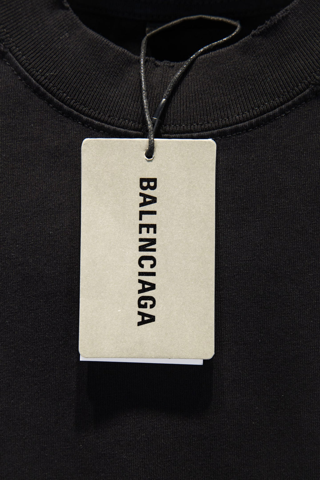 Balenciaga black T-shirt with Balenciaga branded hang tag at neckline