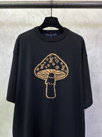 Black short-sleeve T-shirt with large gold mushroom emblem graphic