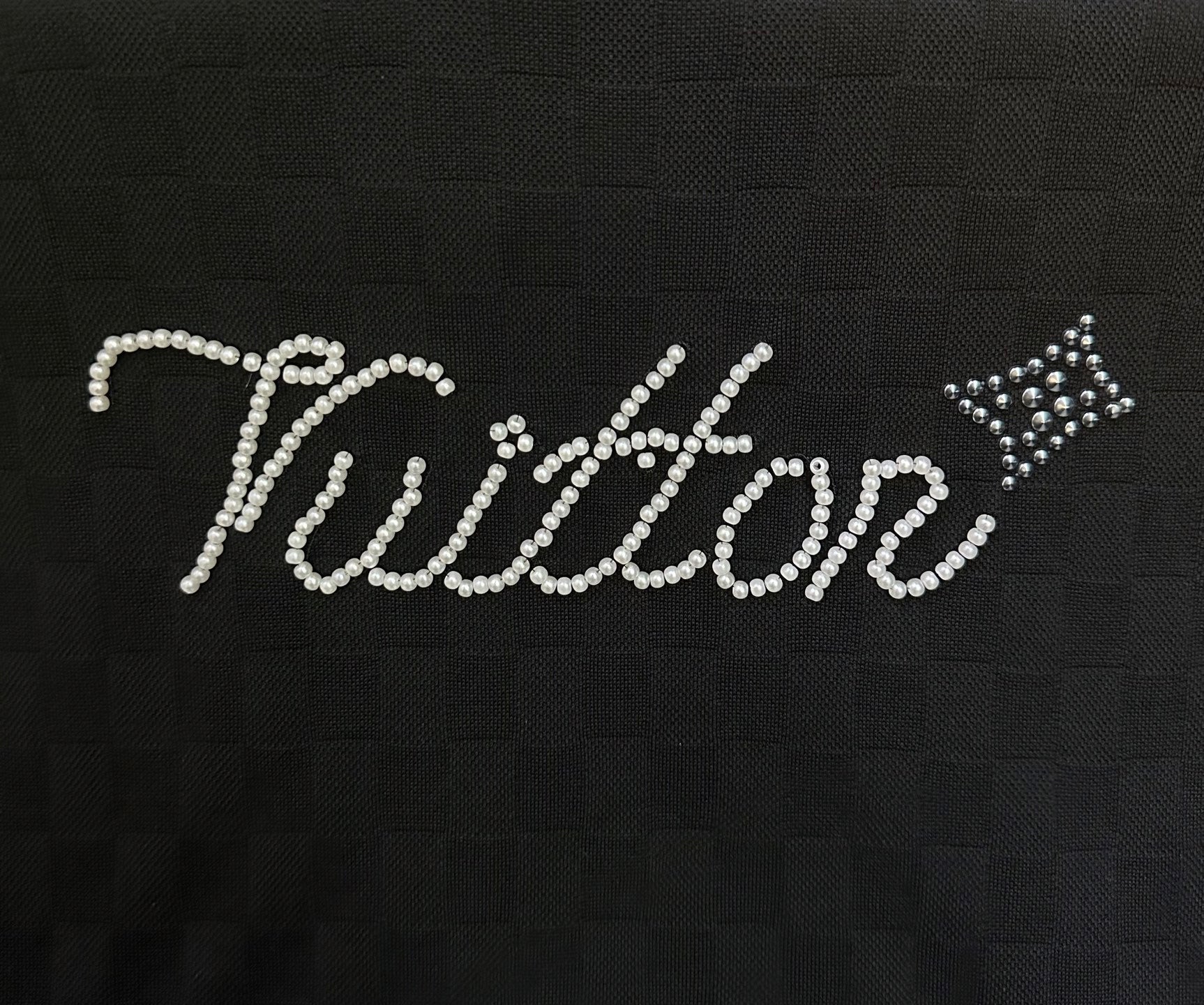 Louis Vuitton rhinestone "Vuitton" logo detail on black textured T-shirt