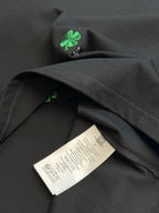 Black short-sleeve T-shirt with care label near hem and side seam