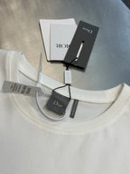 White crew-neck T-shirt with Dior logo and interior label tags