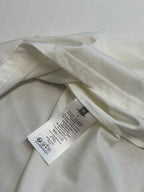 White T-shirt inside view with brand tags and crew neck seam