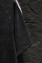 Balenciaga T-shirt side profile with pink stripe detail at shoulder