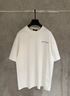 White short-sleeve T-shirt with small chest logo graphic