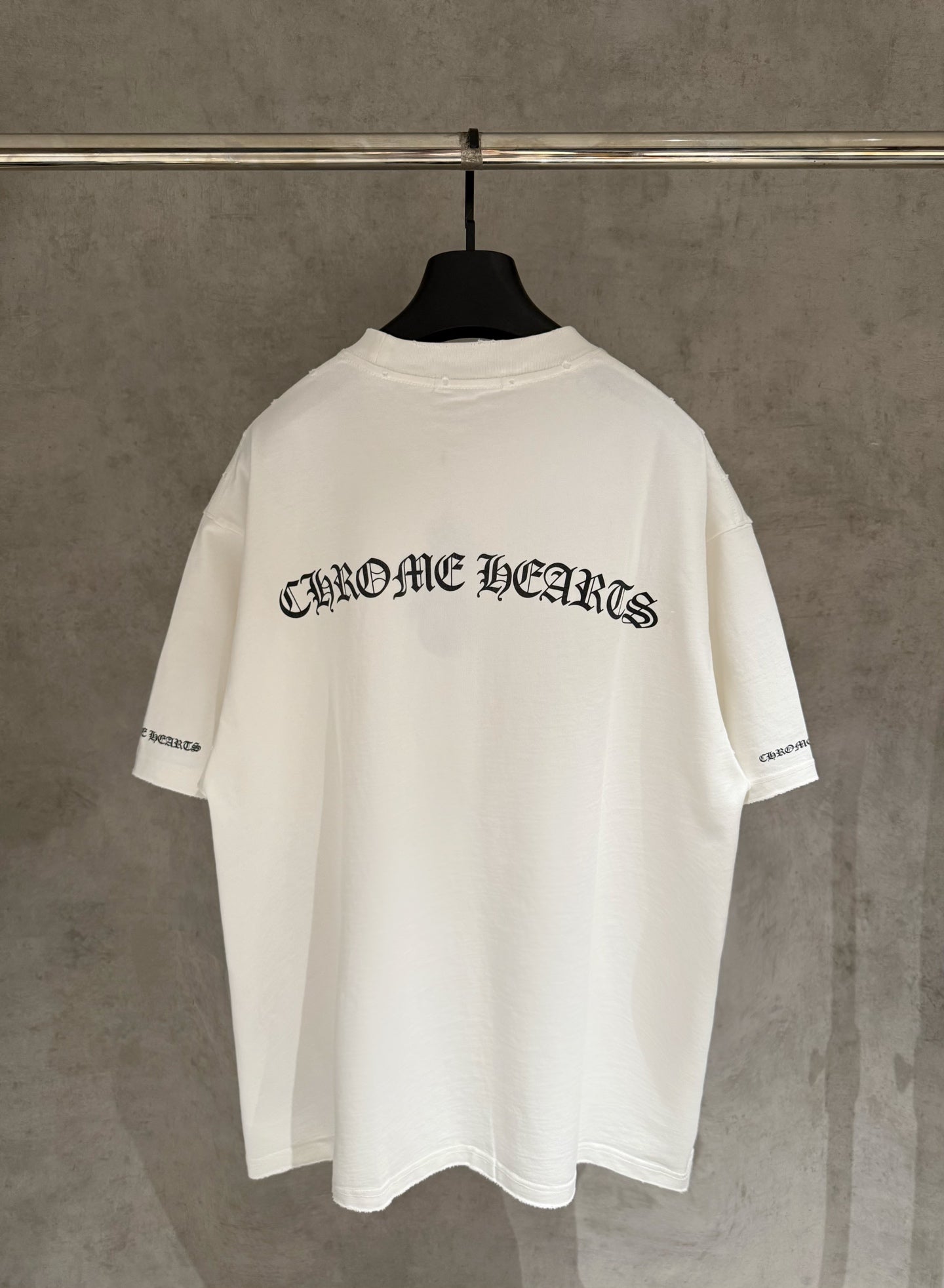 White short-sleeve T-shirt with large back logo text
