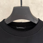 Black T-shirt neck label detail on inside collar