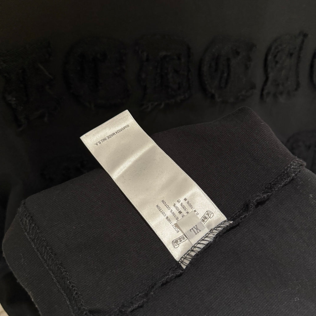 Black T-shirt care label on inside neck seam