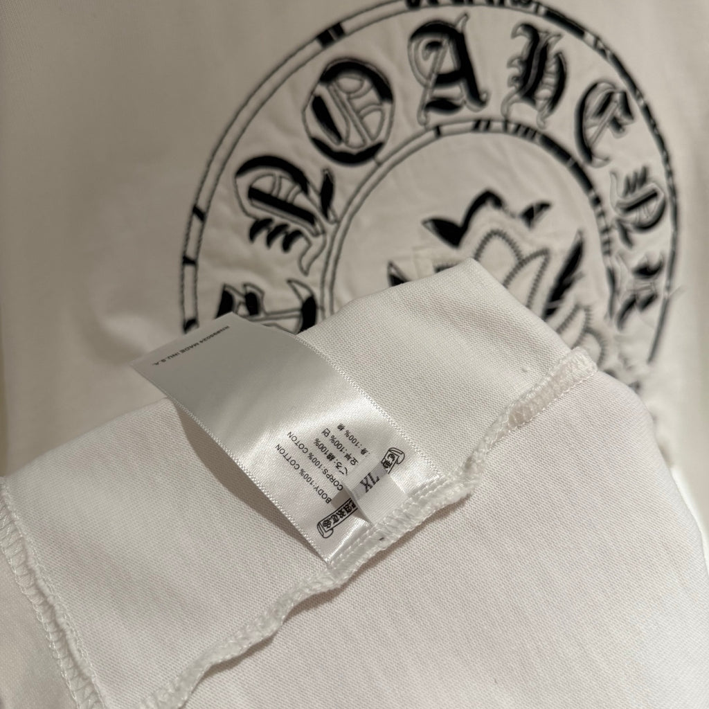 White T-shirt interior label and back graphic print detail near neckline