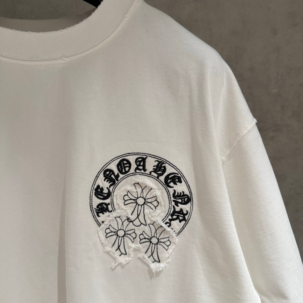 White T-shirt with embroidered chest logo graphic and crew neckline
