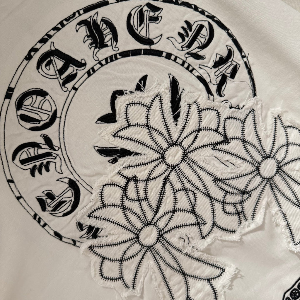 White back graphic wreath close-up with floral and stitched outline details
