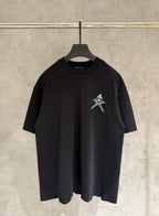 Black short-sleeve T-shirt with small white cross emblem on the chest