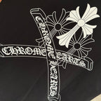 Black short-sleeve T-shirt close-up of white stylized cross graphic