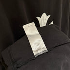 Black short-sleeve T-shirt with inner tag at the hem
