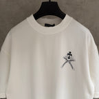 White short-sleeve T-shirt neckline and small black sword-flower chest graphic