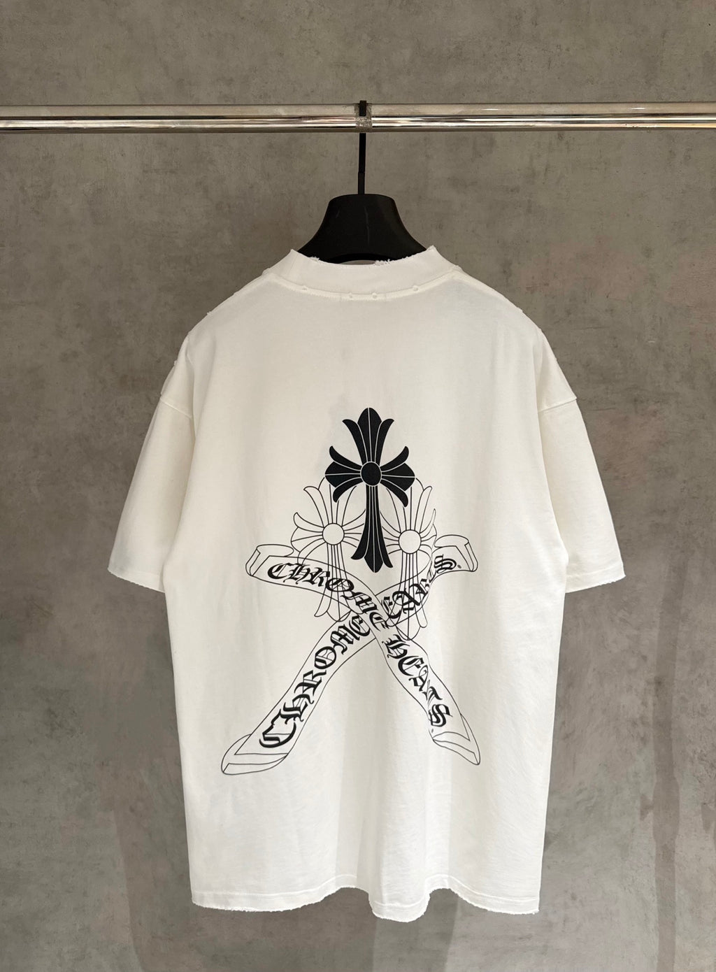 White short-sleeve T-shirt, back view, large black cross-flower logo graphic