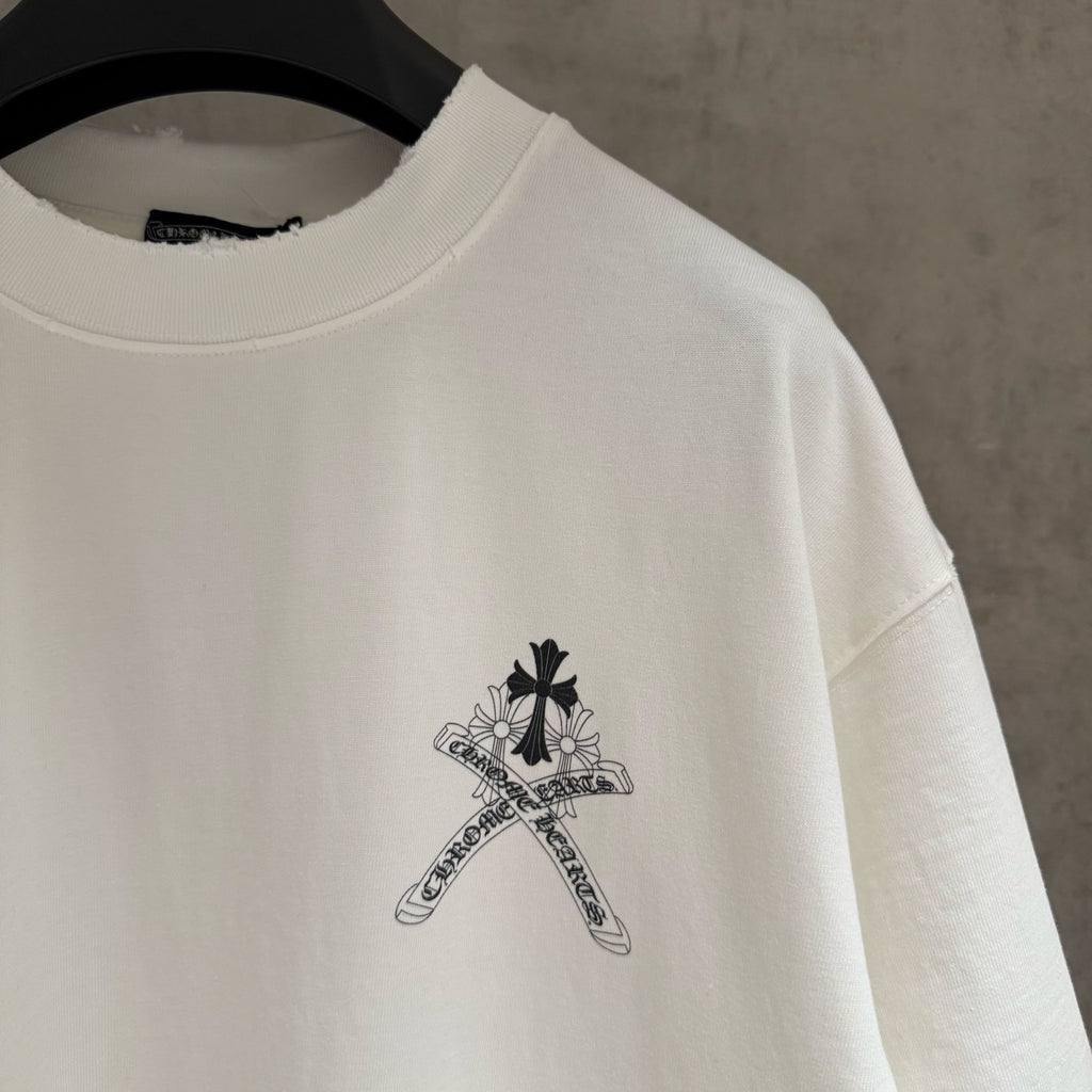White short-sleeve T-shirt sleeve close-up with small black sword-flower graphic