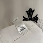 White T-shirt folded with inner care label tag attached
