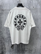 White short-sleeve T-shirt with large black circular skull graphic on the back