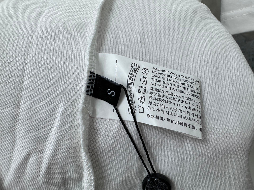 White T-shirt interior care label with washing and temperature instructions