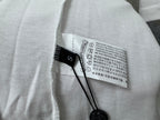 White T-shirt interior care label with washing and temperature instructions