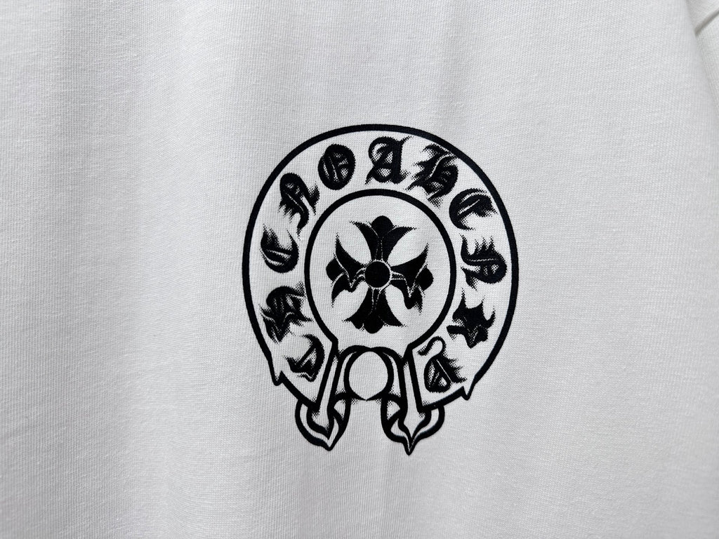 White T-shirt close-up of black circular skull graphic