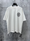 White short-sleeve T-shirt with small black circular graphic on the chest