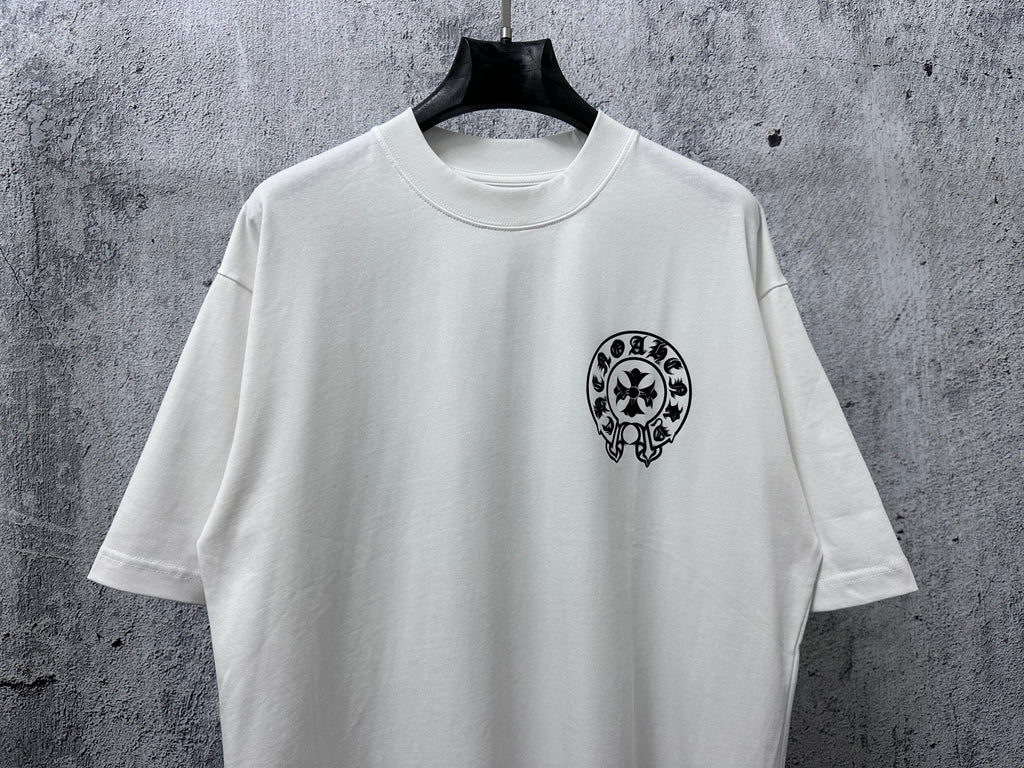 White short-sleeve T-shirt with small black circular graphic on the front