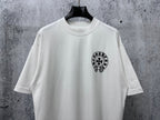 White short-sleeve T-shirt with small black circular graphic on the front