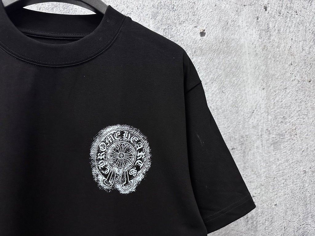 Black short-sleeve T-shirt with detailed circular chrome-style chest graphic