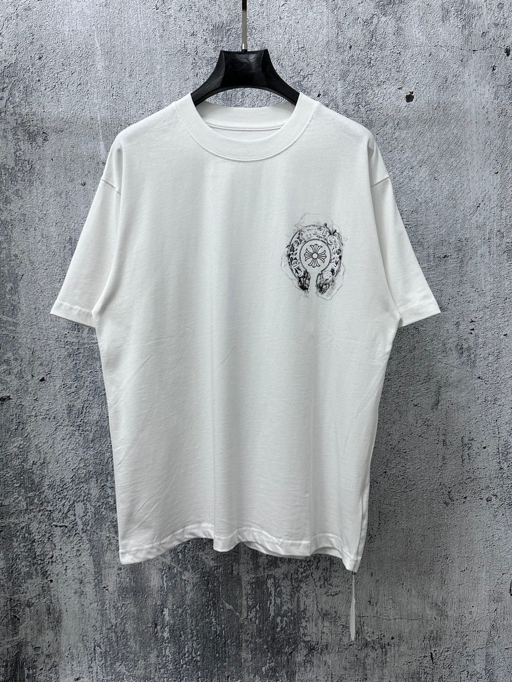 White short-sleeve T-shirt with small chest graphic