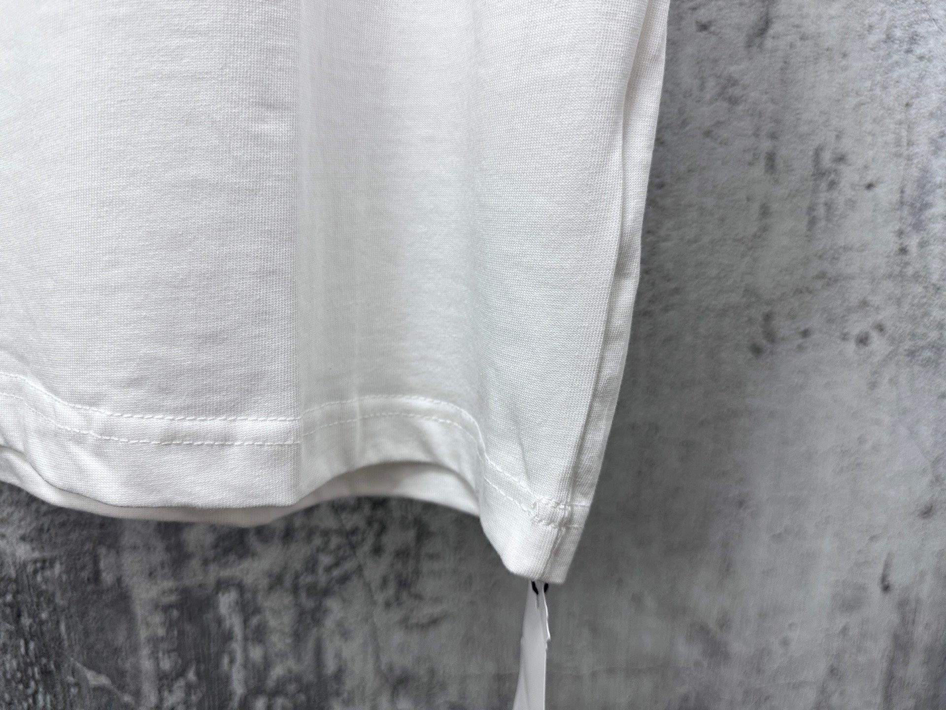 White T-shirt with visible hem and stitching
