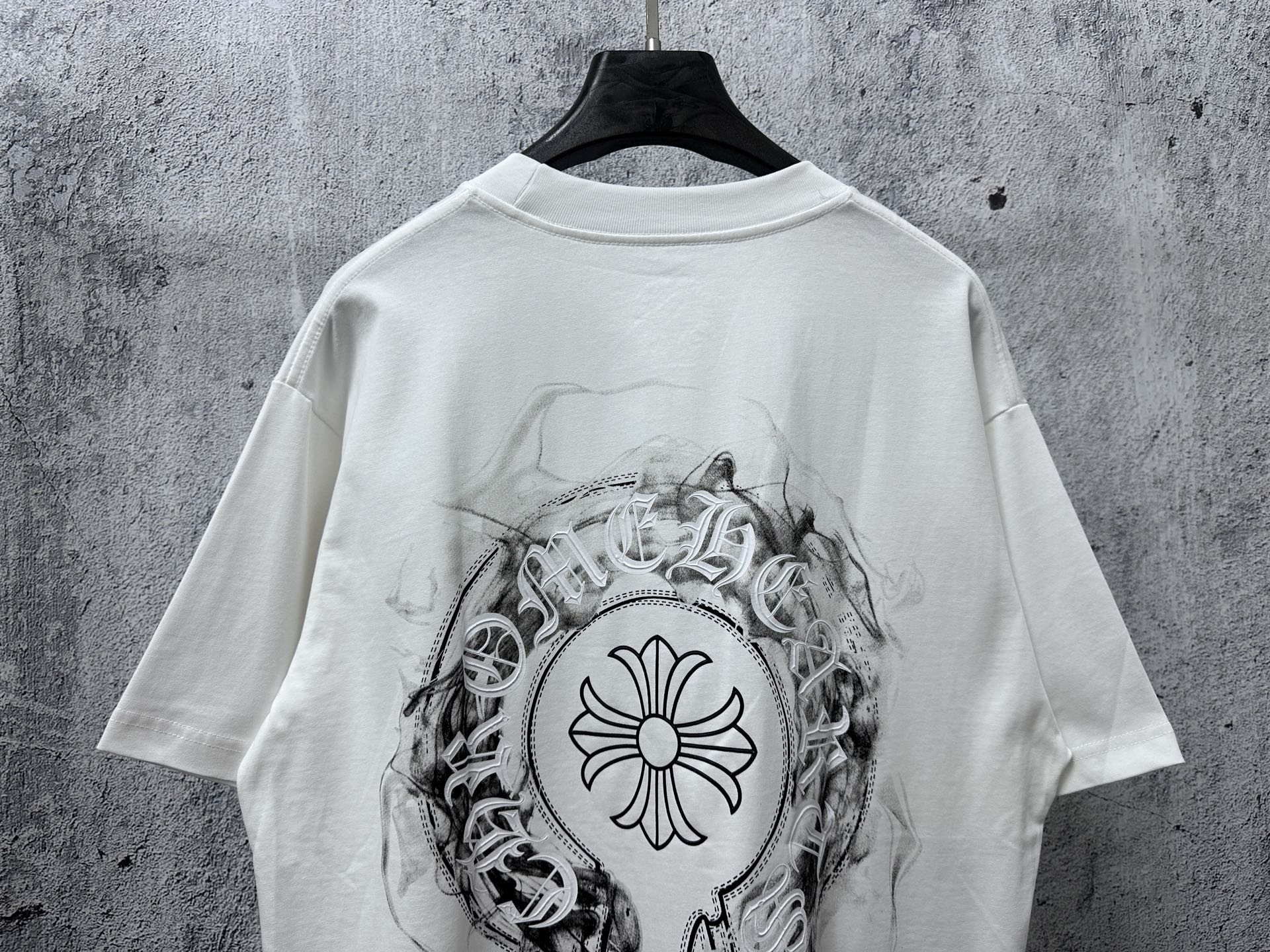 White short-sleeve T-shirt with large circular back emblem graphic