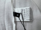 White T-shirt care label with icons and washing instructions