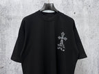 Black short-sleeve crewneck T-shirt with small white cross graphic on right chest