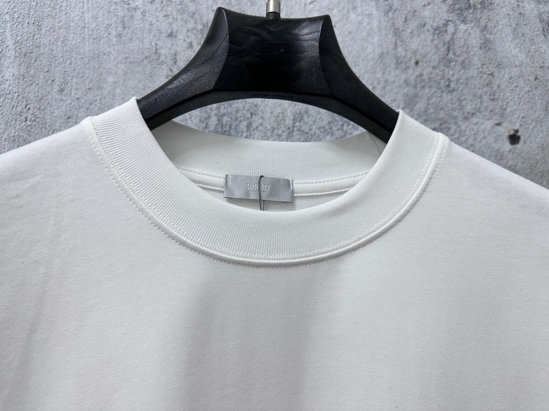 White crewneck T-shirt neckline and collar seam detail