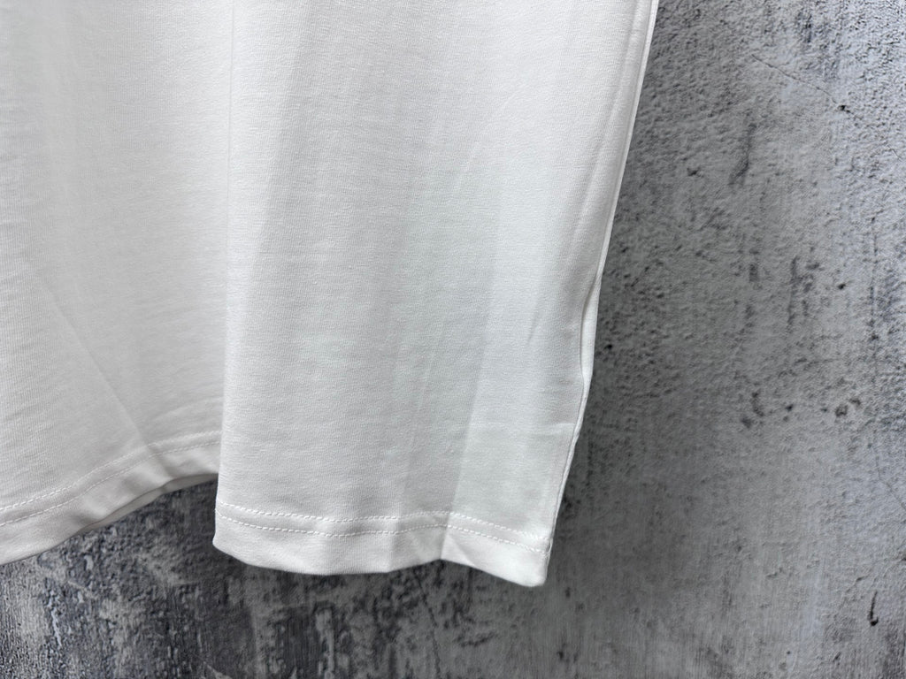 White T-shirt hem and side seam detail under short sleeves