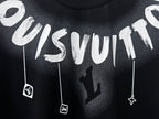Close-up white graffiti lettering and charm graphic on black T-shirt