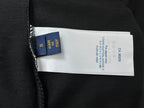 Louis Vuitton size and care label inside black T-shirt, blue brand tag